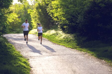Young people jogging and exercising in nature