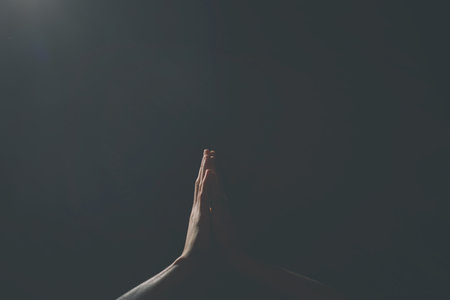 Praying Hands in black background