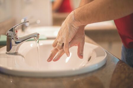 Washing hands rubbing with soap man for corona virus prevention, hygiene to stop spreading coronavirus.の写真素材