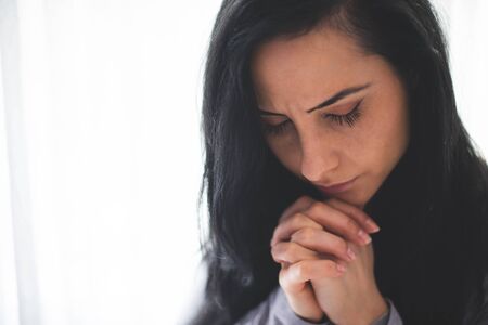 Portrait of woman prayingの写真素材