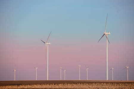 Windmills for electric power production at sunset
