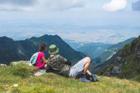 Father and daughter on a mountainの写真素材
