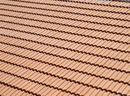 Just covered with brick-tiles new roof in sunlight
