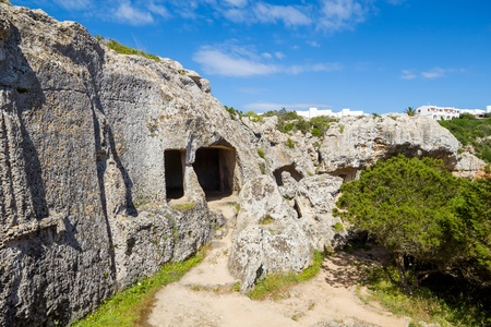 Cala Morell Necropolis Caves in sunny day at Menorca, Spain の写真素材