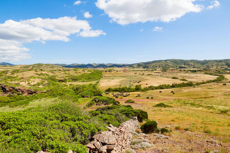 Menorca island field landscape with old traditional masonry fence, Balearic islands, Spain の写真素材