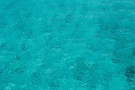Turquoise see water surface background.の写真素材