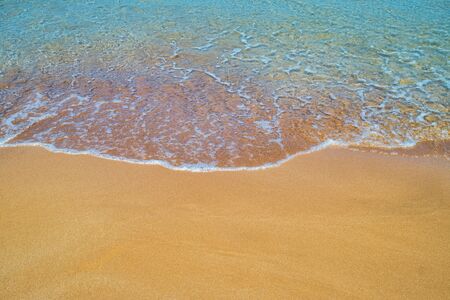 Yellow sand beach close up summer background.