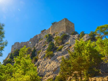 The Castle of Monolithos on the high cliff, Rhodes island, Greece.の写真素材