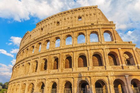 The Colosseum or Coliseum amphitheatre at sunset in the center of Rome, Italy.の写真素材