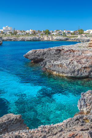 Mediterranean Sea small cove with crystal clear water in the region of Ciutadella, Menorca island, Spain.の写真素材