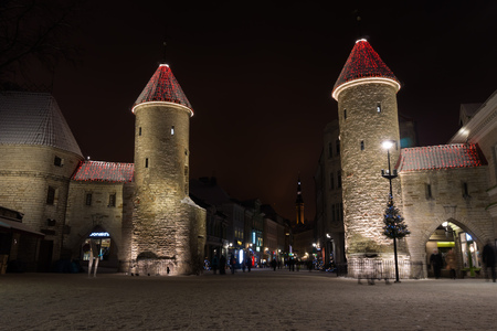 Tallinn, Estonia - January 3, 2017: The Main Entrance Towers of Tallinn Old Town at Night during Christmas Time.のeditorial素材