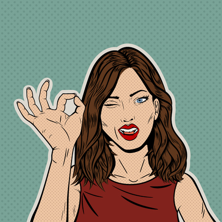 Vintage Pop Art Illustration with Brunette Womanâs Face with OK Gesture of the Hand and Winking with the Eye. Comic Book Close-Up Girl Giving an OK. Retro Style Card. Approbation concept. Vector Illustration.のイラスト素材