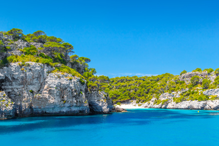 Cala Macarelleta Beach and Punta de Macarella Sea Cliff at Menorca Island, Spainの写真素材