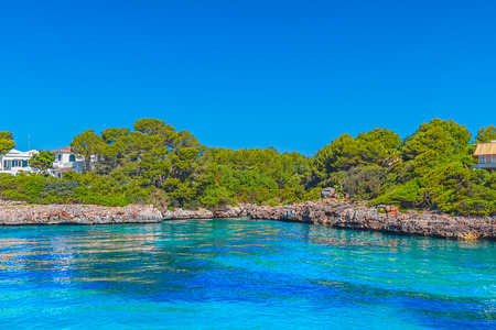Menorca Island Coast Cliffs with Clean Blue Water of the Mediterranean Sea in Ciutadella Area, Spain.の写真素材