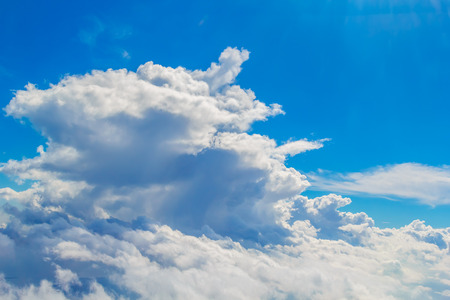 Big Cumulus Cloud in Sunlight Background. Blue Sky with Cloudscape Backdrop.の写真素材
