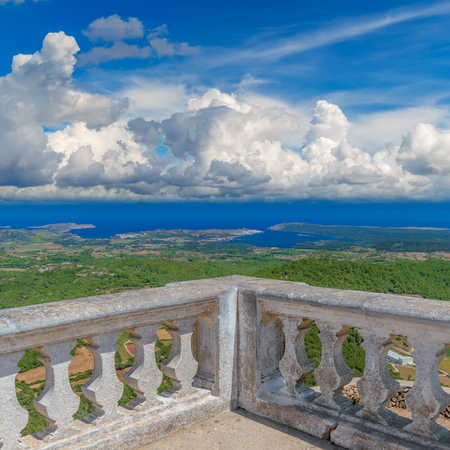 Menorca Island Sunny Landscape with Mediterranean Sea Coastline in the Background viewed from Monte Toro, Spain.の写真素材