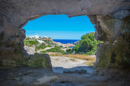 View From the Inside of Cala Morell Necropolis Caves at Menorca, Spain.の写真素材