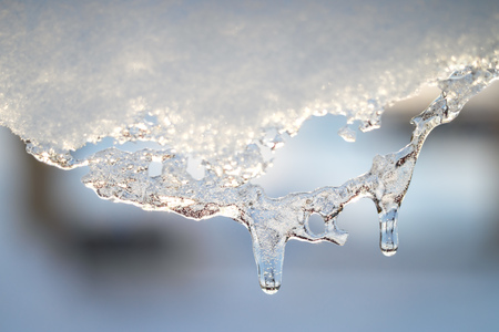 Snow melting icicle spring background. Macro shot.の写真素材