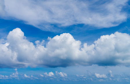 White Fluffy Clouds on Blue Sky Background. Summer Sky Backdrop.の写真素材