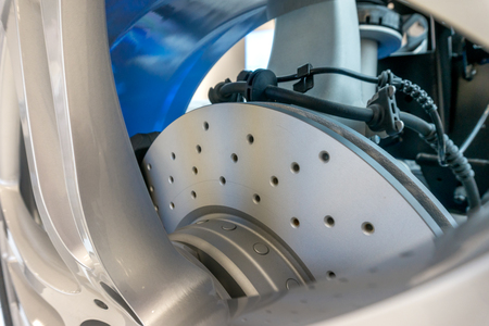 Modern Car Disk Brakes Close-Up with Drilled Disc Surface.の写真素材