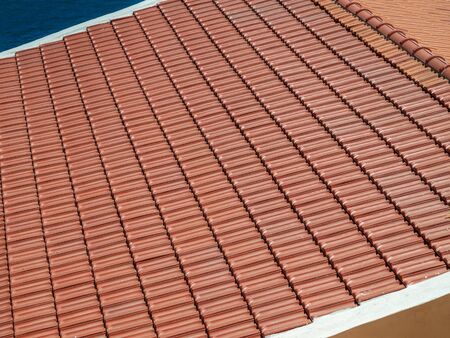 Red Clay Tile Roof. Ceramic Roofing Technology.の写真素材