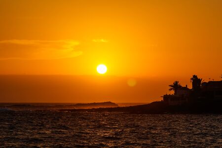 Tropical Orange Sunset over Sea Shore. Travel Background.の写真素材