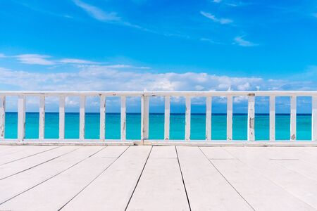 White Wooden Terrace with Beautiful Sea View. Summer Tropical Background.の写真素材