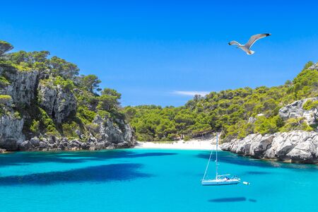 Cala Macarelleta Beach with Turquoise Water of Mediterranean Sea. Menorca Island Travel Background.の写真素材