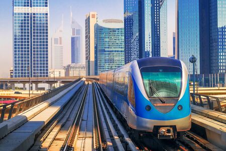 City Metro Train in Sunlight on the Outdoor Railway. Modern City Transport Background.の写真素材