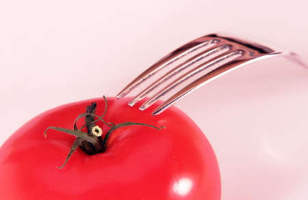 Tomato and forkの写真素材