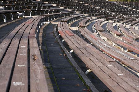 Empty wooden  seats in a sports stadiumの写真素材