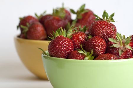 Fresh and tasty strawberries in two bowlsの写真素材