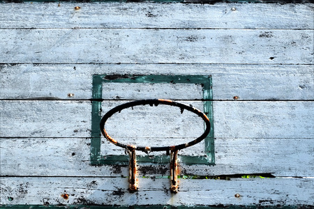Close up old basketball hoop with blue sky background.の写真素材