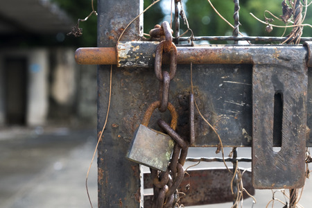 Old door bolt and chain with lock.の写真素材