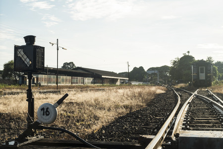Railroad switch with train in the morning.の写真素材