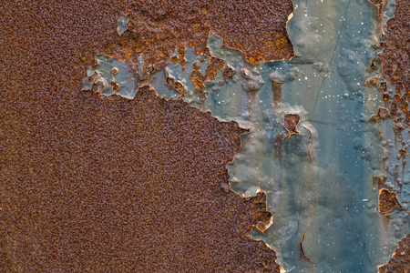 Rusted blue painted metal wall. Rusty metal background with streaks of rust