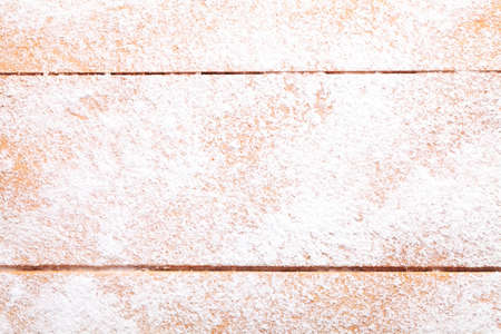 Wooden board with powdered sugarの写真素材