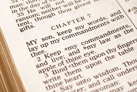 Detail of the Bible opened on book of Proverbs