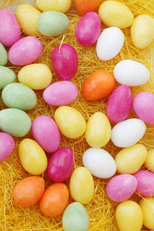 Candy eggs on plate, top view 