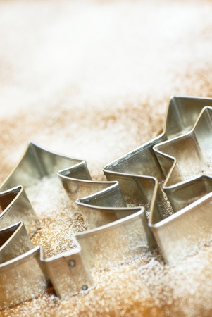 Cookie cutters on white flour or sugar backgroundの写真素材