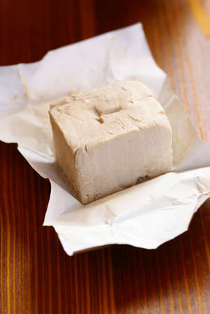 Close-up of yeast on wooden background