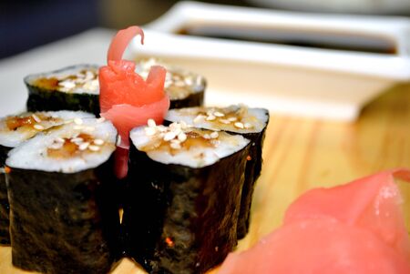 Maki roll with eel, sesame seeds, ginger and soy sauce from Japanese cuisineの写真素材