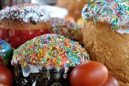 Easter pastries, traditional Easter cake covered fondant and beautiful multi-colored eggsの写真素材