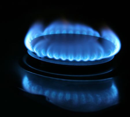 a blue gas light on a black background