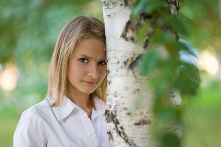 Girl with a beautiful smile on blurred backgroundの写真素材