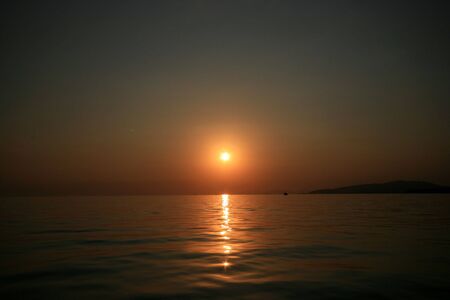 sunset above the seaの写真素材