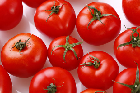 Red tomatos background, selective focusの写真素材