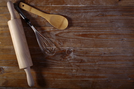 Set of appliances for baking on brown wooden table top coyspace, horizontal pictureの写真素材