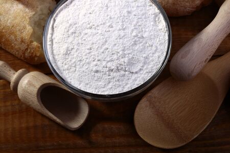 Flour and wooden appliances for baking closeup, horizontal picture