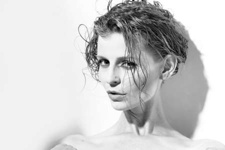 Portrait of sensual cool beautiful slim woman with wet short hair の写真素材